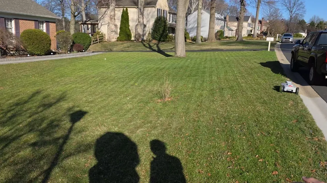 Reference front-yard install with single-zone mowing setup